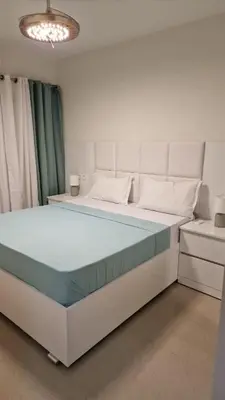 a large bed in a room with at SUITES-HOME, CIDADELA in Praia