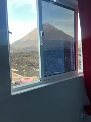 a window with a view of a mountain at Casa Adriano & Filomena in Portela