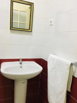 a bathroom with a white sink and a mirror at Constança Retreat in Mindelo