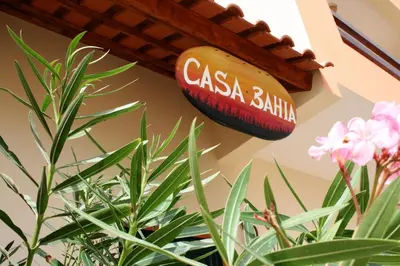 a sign that reads casa balilla hanging on a wall at Casa Bahia 6 in Santa Maria
