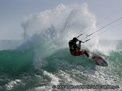 a man riding a wave on a surfboard in the ocean at Casa Bahia 6 in Santa Maria