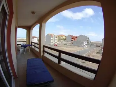a balcony with a window with a view of a street at Casa Bahia 7 in Santa Maria