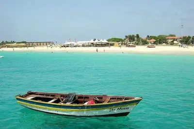 a small boat in the water near a beach at Casa Bahia 7 in Santa Maria
