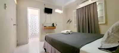 a bedroom with a bed with a towel on it at OpenSky in São Filipe