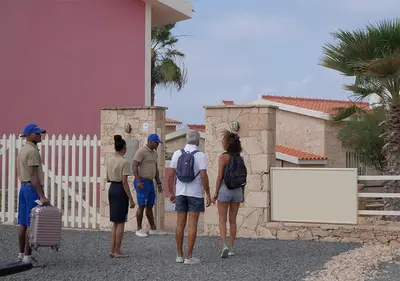 a group of people standing outside of a building at Appartamento BICA. Stella Maris Exclusive in Calheta Do Maio