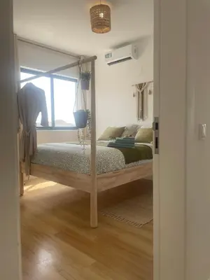 a bedroom with a bed with a large mirror at Ocean View Santa Filomena in Mindelo