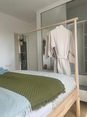a bedroom with a bed and a mirror at Ocean View Santa Filomena in Mindelo