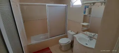 a bathroom with a shower and a toilet and a sink at Óscar in Mindelo