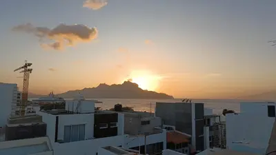 a view of the sunset from a city at Óscar in Mindelo