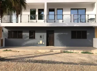 a white house with a balcony on top of it at Tity Apartments T2- Santa Maria in Santa Maria