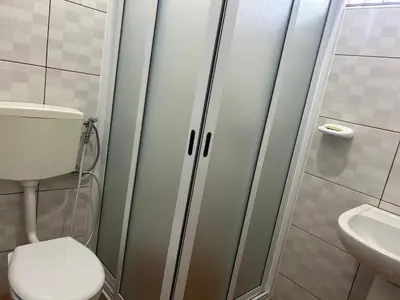 a bathroom with a toilet and a sink at Casa Manuel & Elvira in Chão Queimado