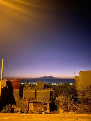 a view of a city at night from a building at Casa Graciosa in Tarrafal