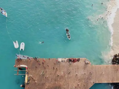 an aerial view of a beach with boats in the water at Studio Apt Bounty Condominium, Santa Maria in Santa Maria