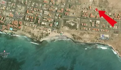 a map of a beach with a red arrow at Studio Apt Bounty Condominium, Santa Maria in Santa Maria