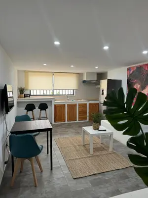 a kitchen with a table and chairs in a room at Maison da Praia in Praia