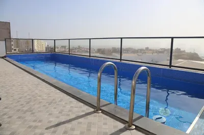 a large swimming pool on top of a building at Maison da Praia in Praia