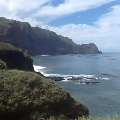 a view of the ocean with mountains in the background at Questel BronQ in Chã da Igreja