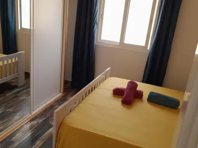 a bedroom with a bed with two stuffed animals on it at Pandora Ocean View am Praia Cabral in Sal Rei