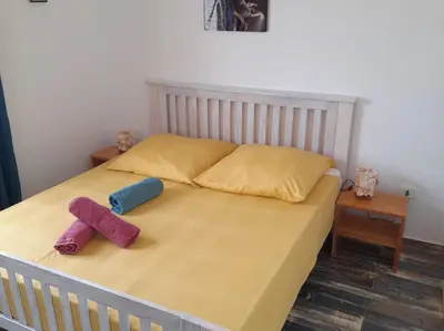 a bed with two mitts sitting on top of it at Pandora Ocean View am Praia Cabral in Sal Rei
