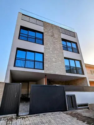 a tall building with blue windows on it at Tarrafal Bay - 1Bdr Apt - Sea view - 2 in Tarrafal