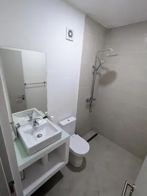 a bathroom with a sink and a toilet and a shower at Tarrafal Bay - 1Bdr Apt - Sea view - 2 in Tarrafal