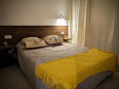 a bedroom with a bed with two pillows on it at Tarrafal Bay - 1Bdr Apt - Sea view - 2 in Tarrafal