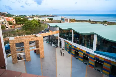 an overhead view of a building with the ocean in the background at Hotel Vip Praia in Praia