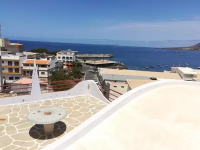 a view of the ocean from the balcony of a building at Zena Star in Tarrafal