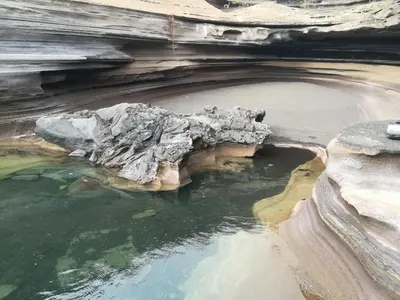 a large pool of water in a cave at Zena Star in Tarrafal