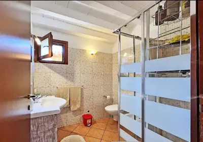 a bathroom with a sink and a toilet at Beautiful loft in Porto Antigo 1 in Santa Maria