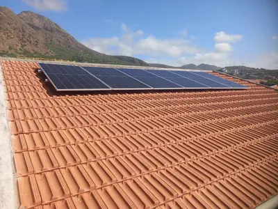 a group of solar panels on top of a roof at Casa Herminia in Tarrafal