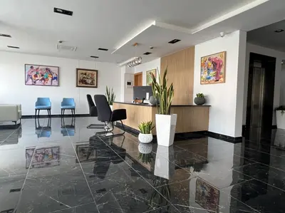 an office with chairs and a reception desk at Hôtel Blue Sky in Tarrafal