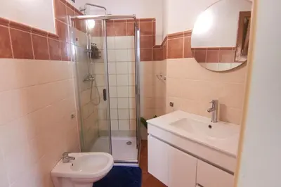 a bathroom with a shower and a sink and a toilet at Calma de Sal Porto Antigo II Beach apartment in Santa Maria