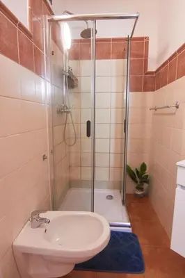 a bathroom with a shower and a toilet and a sink at Calma de Sal Porto Antigo II Beach apartment in Santa Maria