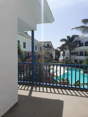 a view of the pool from the balcony of a resort at Holiday Properties Leme Bedje in Santa Maria