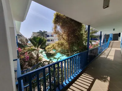 a balcony with a view of a pool at Holiday Properties Leme Bedje in Santa Maria