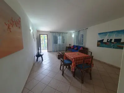 a dining room with a table and chairs in a room at Holiday Properties Leme Bedje in Santa Maria