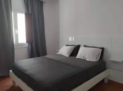 a bedroom with a large bed with two pillows at Apartament in Porto Antigo 2 - Santa Maria in Santa Maria