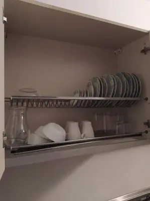 a shelf in a refrigerator with plates and bowls at Apartament in Porto Antigo 2 - Santa Maria in Santa Maria