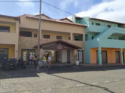 a group of people standing outside of a building at Apartament in Porto Antigo 2 - Santa Maria in Santa Maria
