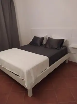 a bed with two pillows on it in a room at Apartament in Porto Antigo 2 - Santa Maria in Santa Maria