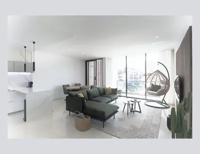 a living room with a couch and a table at Filomena Apartments ORIENTAL in Mindelo