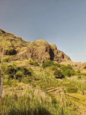 a view of a mountain with grass and rocks at Casa Medina in Fajãzinha