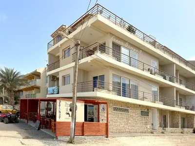 an apartment building with a pole in front of it at Ocean Breeze 9 in Sal Rei