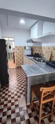 a kitchen with a large counter top in a room at Casas do Cinema II in Mindelo