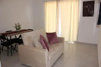 a living room with a couch and a table at WEYt1 in Sal Rei