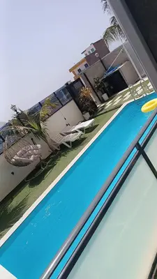 a swimming pool with a frisbee on top of it at Hotel Xinte na casa in Tarrafal