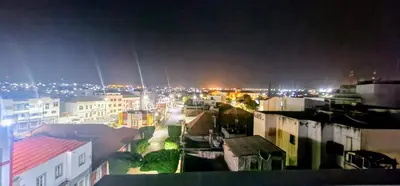 a view of a city at night with lights at ACG Plato Vacation Apartment with Balcony in Praia