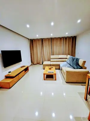 a living room with a couch and a flat screen tv at ACG Plato Vacation Apartment with Balcony in Praia