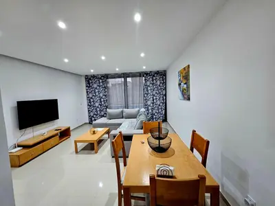 a living room with a couch and a table at ACG Plato Terrace & Balcony Apartments in Praia